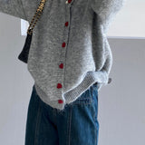 Cardigan oversize con scollo rotondo e bottoni a cuore