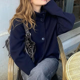 Cappotto elegante in lana tinta unita con bottoni e collo alto