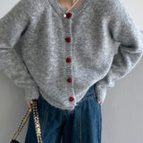 Cardigan oversize con scollo rotondo e bottoni a cuore