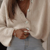 Elegante cardigan monopetto in maglia tinta unita