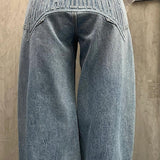 Jeans larghi con gamba curva e lettere in rilievo lavati