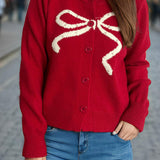 Cardigan rotondo jacquard con fiocco solido