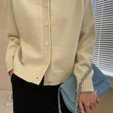 Cardigan raglan con bottoni in giada