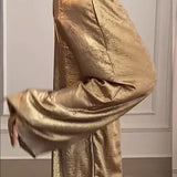 Completo due pezzi da donna: maglia ampia e pantaloni larghi in raso