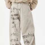 Jeans dritti in denim con graffiti color albicocca