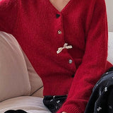 Cardigan con scollo a V, fiocco e bottoni