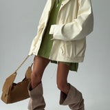 Giacca con tasca portaoggetti e coulisse in vita