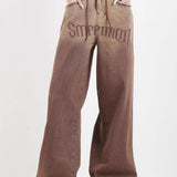 Jeans vintage a gamba larga sfilacciati a vita alta sfumati