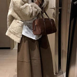 Gonna morbida a vita alta con volant in misto lana