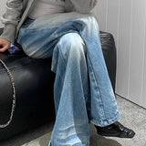 Jeans dritti lunghi fino al pavimento, lavati e stropicciati