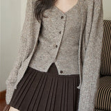 Gonna a vita alta plissettata in lana tinta unita