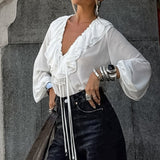 Camicetta bianca con scollo a V e maniche a lanterna