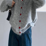Cardigan oversize con scollo rotondo e bottoni a cuore