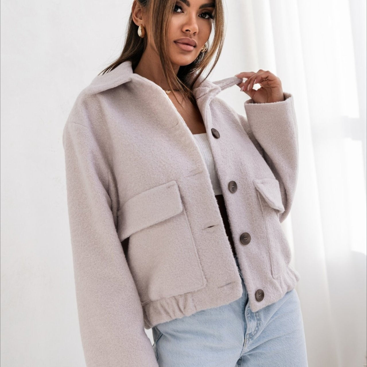 Cappotto alla moda in lana tinta unita con elastico e bottoni automatici