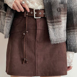 Gonna a trapezio con nappe in vita