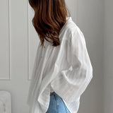 Camicetta con collo alto in jacquard di cotone bianco