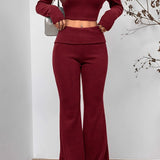 Completo due pezzi sexy con top corto e pantaloni aderenti con spalle scoperte