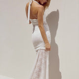 Abito lungo aderente con spacco alto, senza spalline, in pizzo trasparente e patchwork