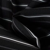 Camicetta a maniche lunghe con colletto a righe intrecciate e cintura annodata in vita