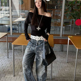 Jeans a gamba larga con schizzi di vernice e graffiti