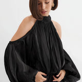 Blusa a maniche lunghe con spalle scoperte dal design unico