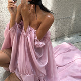 Mini abito a fascia con orlo asimmetrico e motivo a tulipano fluido