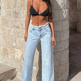 Jeans larghi e sfilacciati a vita alta