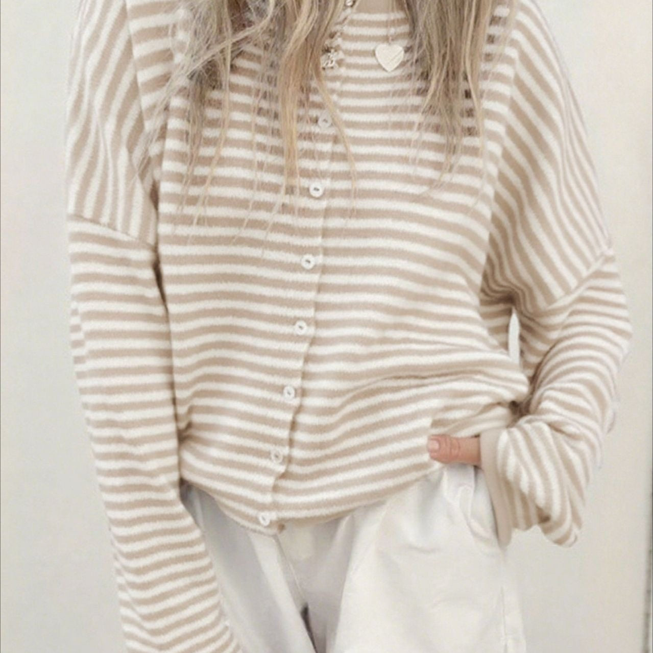 Cardigan girocollo in maglia a righe