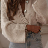 Elegante cardigan monopetto in maglia tinta unita