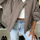 Cappotto imbottito casual con bottoni tinta unita