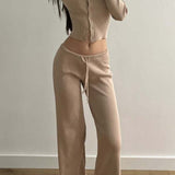 Completo due pezzi sexy in maglia aderente con bottoni, maniche lunghe e vita bassa