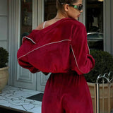 Completo sportivo in due pezzi con colletto in velluto e cerniera a maniche lunghe