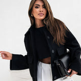 Cappotto alla moda in lana tinta unita con elastico e bottoni automatici