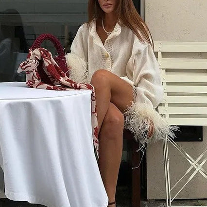 Elegante cardigan con finiture in piume