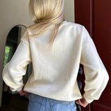 Blusa girocollo rilassata, dolce ed elegante