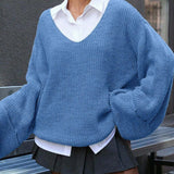 Blusa vintage in maglia con scollo a V e spacchi