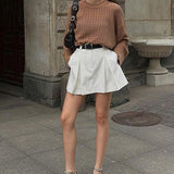 Minigonna bianca plissettata a vita alta