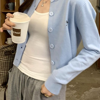 Cardigan in maglia con fiocco ricamato