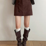 Gonna a trapezio con nappe in vita