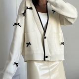 Cardigan in maglia a maniche lunghe con fiocco e scollo a V e blocchi di colore