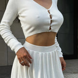 Completo due pezzi con gonna e top corto in maglia sexy