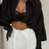 Camicetta vintage in raso con maniche a lanterna