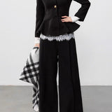 Cappotto elegante in lana nera con vita plissettata