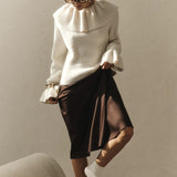 Camicetta vintage con maniche svasate e volant