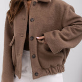 Cappotto alla moda in lana tinta unita con elastico e bottoni automatici