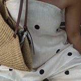 Completo da ufficio in due pezzi con top a tubino a pois e pantaloni larghi