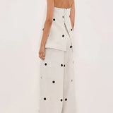 Completo da ufficio in due pezzi con top a tubino a pois e pantaloni larghi