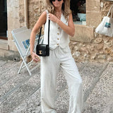 Completo da ufficio a due pezzi con gamba larga a righe in cotone e lino