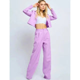 Completo da ufficio in due pezzi con pantaloni larghi e aderenti primaverili