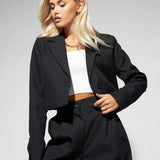 Completo da ufficio in due pezzi con pantaloni larghi e aderenti primaverili